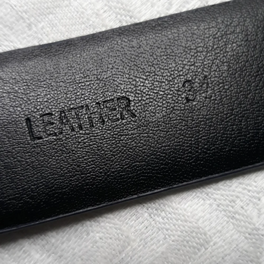 Calvin Klein dark blue leather belt. 34 inches long